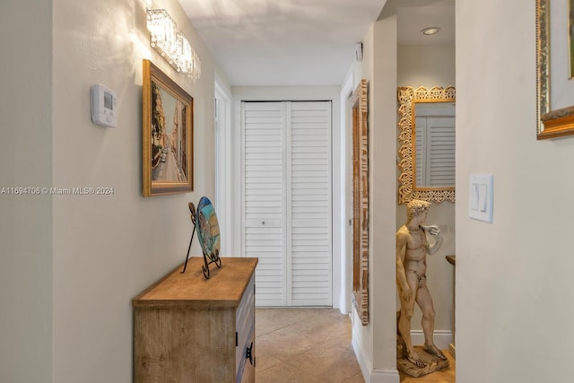 hallway with light tile patterned floors