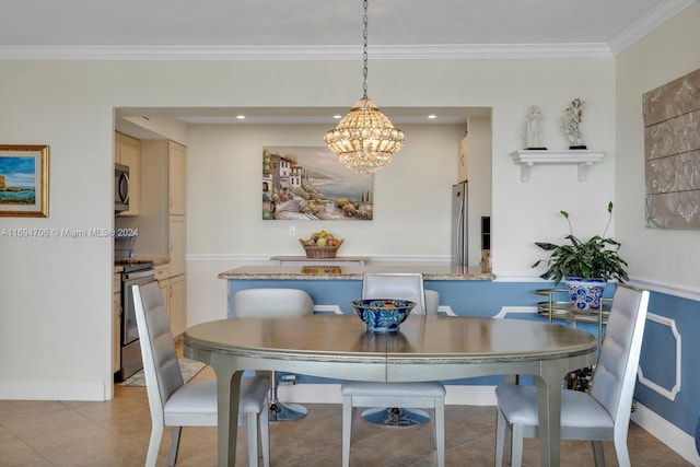 tiled dining room featuring a chandelier and ornamental molding