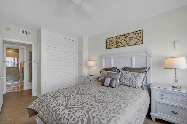 carpeted bedroom with ceiling fan and a closet