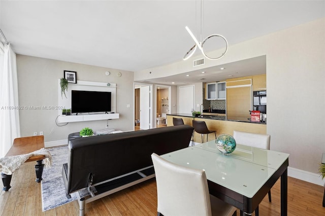 dining area with light hardwood / wood-style flooring