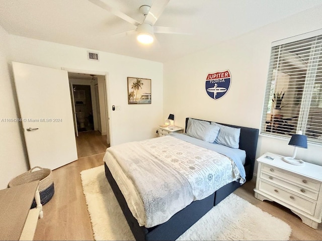 bedroom featuring ceiling fan and light hardwood / wood-style flooring