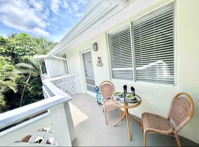 view of patio featuring a balcony