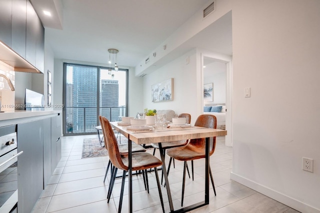 227 NE 2nd St Unit 1705, Miami, FL 33132 - dining space with light tile patterned floors and baseboards