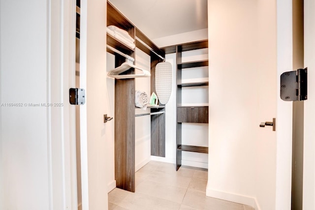 227 NE 2nd St Unit 1705, Miami, FL 33132 - spacious closet featuring light tile patterned floors