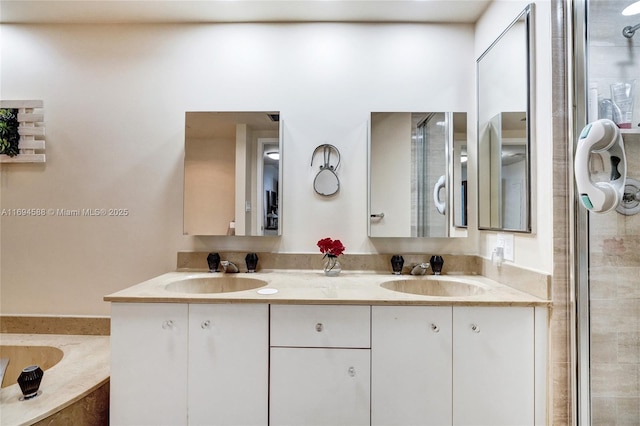 bathroom with vanity and independent shower and bath