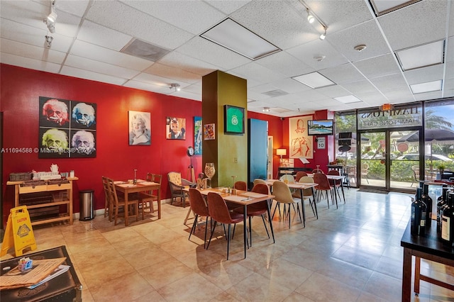 interior space with floor to ceiling windows and rail lighting