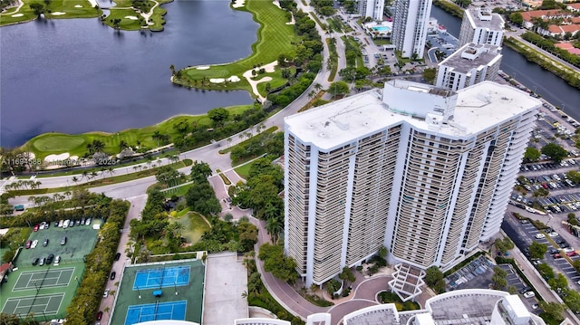 birds eye view of property with a water view