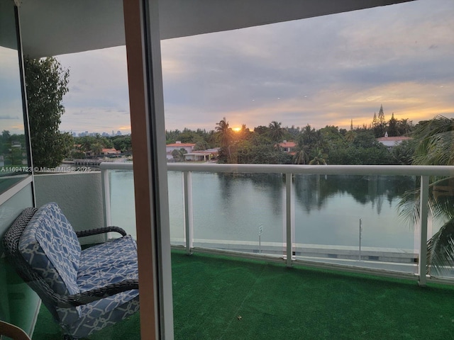 balcony at dusk with a water view