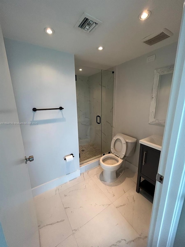 bathroom with vanity, toilet, and walk in shower