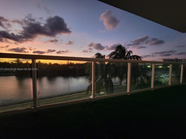 balcony at dusk with a water view