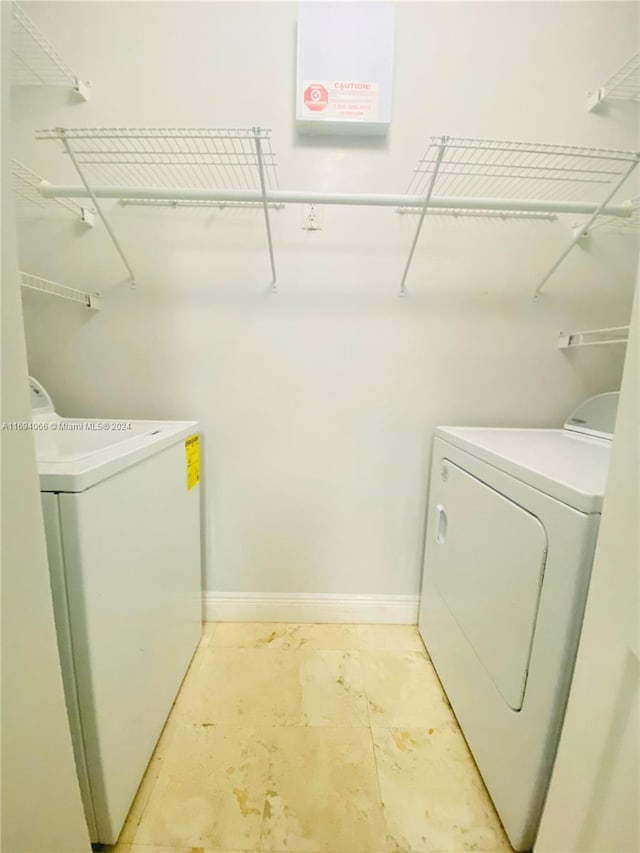 laundry room with washing machine and dryer