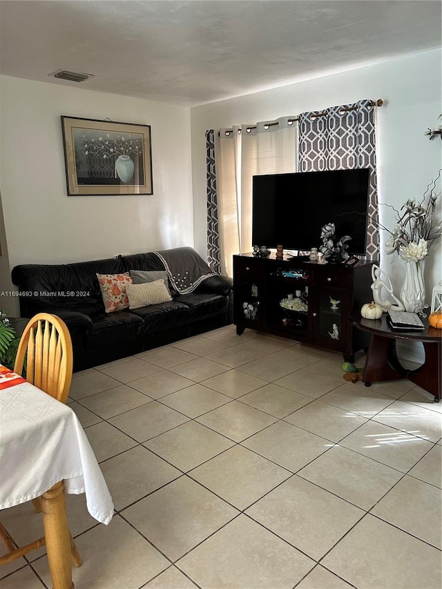 living room with light tile patterned floors