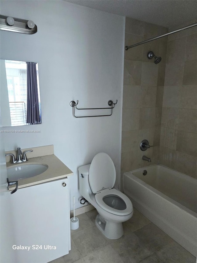 full bathroom with vanity, tile patterned floors, toilet, and shower / bathtub combination