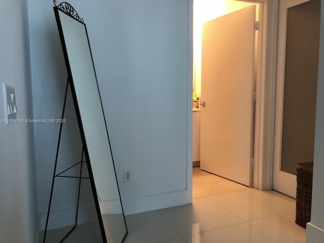 hallway featuring light tile patterned flooring