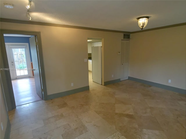 empty room featuring ornamental molding