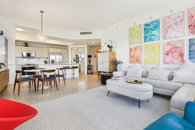 living room with a chandelier