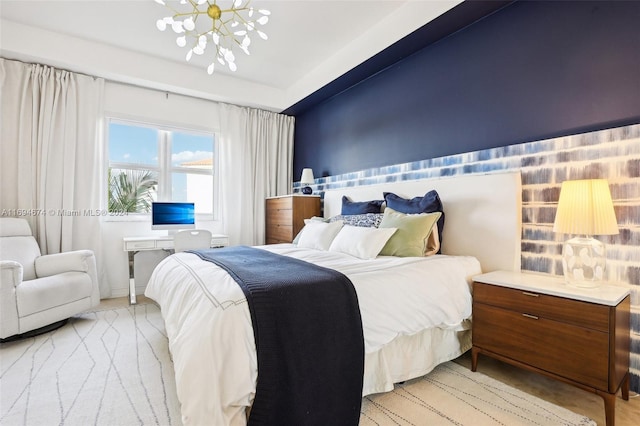 bedroom featuring light colored carpet and a notable chandelier