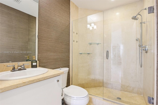 bathroom with walk in shower, vanity, a chandelier, and toilet