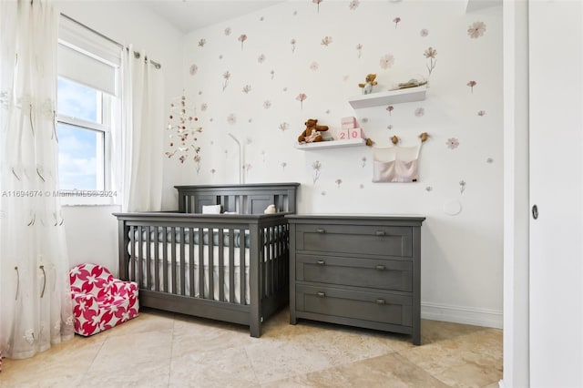 bedroom featuring a crib