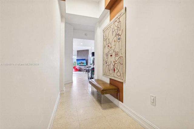 hallway featuring light tile patterned floors