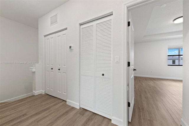 hallway featuring light hardwood / wood-style flooring