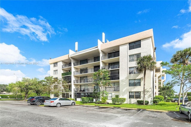 6195 Rock Island Rd Unit 413, Tamarac, FL 33319 - view of apartment building / complex with uncovered parking