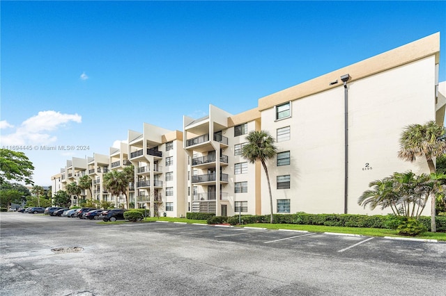 6195 Rock Island Rd Unit 413, Tamarac, FL 33319 - view of apartment building / complex featuring uncovered parking