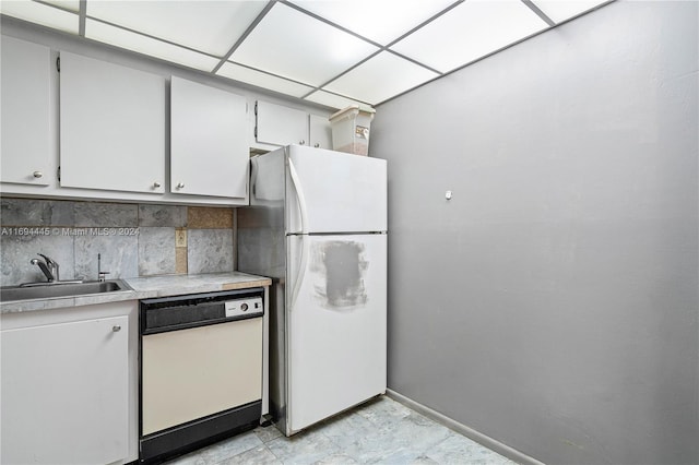 6195 Rock Island Rd Unit 413, Tamarac, FL 33319 - kitchen with white appliances, a sink, baseboards, light countertops, and backsplash