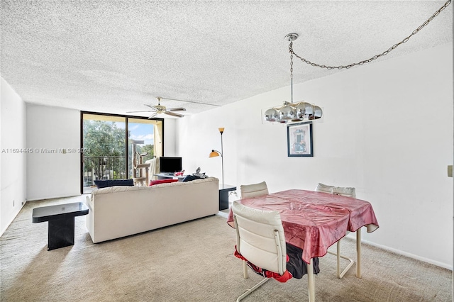 6195 Rock Island Rd Unit 413, Tamarac, FL 33319 - dining space with carpet flooring, a chandelier, a textured ceiling, and ceiling fan