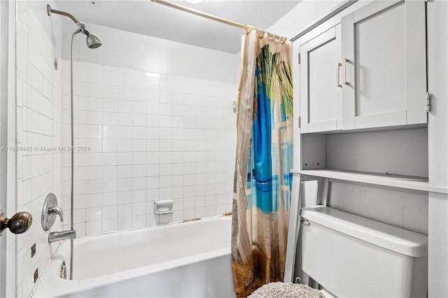 bathroom with toilet and shower / bath combo with shower curtain