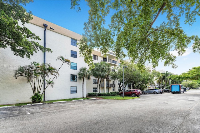 6195 Rock Island Rd Unit 413, Tamarac, FL 33319 - view of property featuring uncovered parking