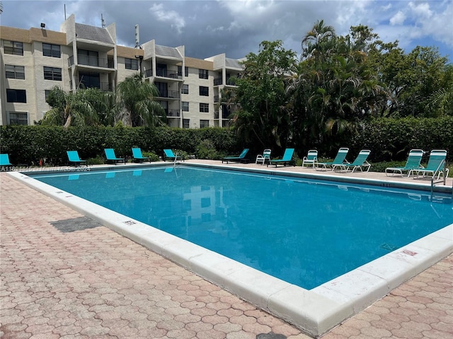 6195 Rock Island Rd Unit 413, Tamarac, FL 33319 - community pool with a patio area