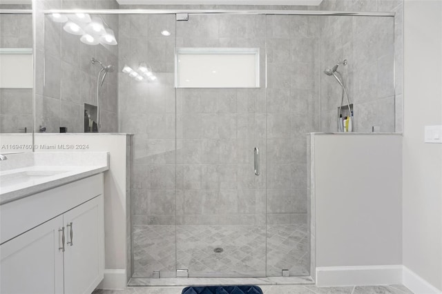 bathroom with vanity and an enclosed shower