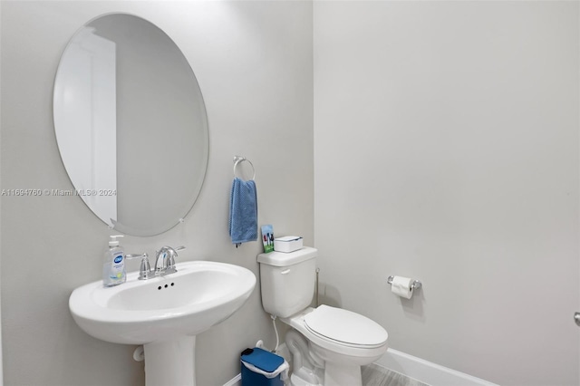 bathroom with toilet and sink