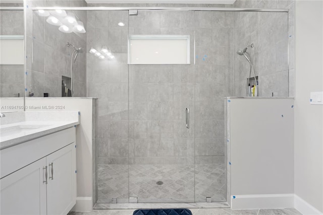 bathroom featuring vanity and walk in shower