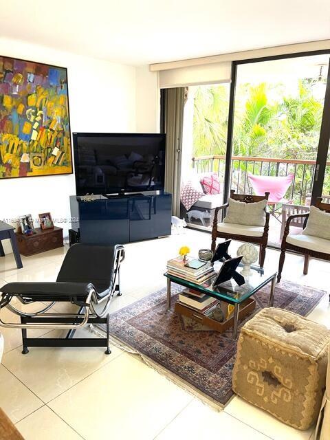 tiled living room with a wealth of natural light