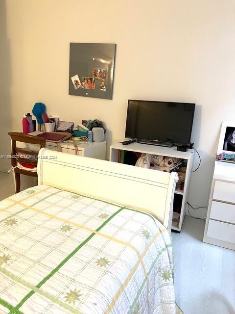 bedroom featuring hardwood / wood-style flooring