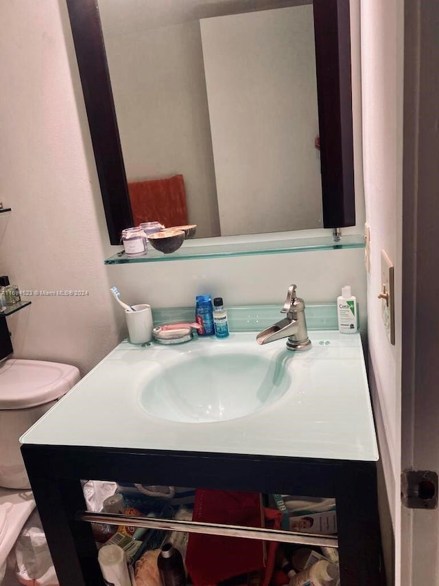 bathroom with vanity and toilet