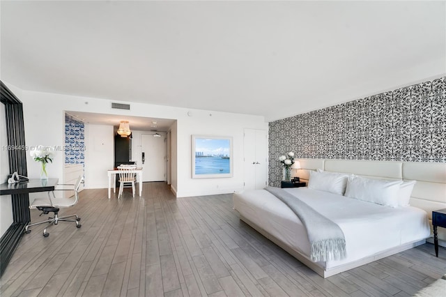 bedroom featuring hardwood / wood-style floors