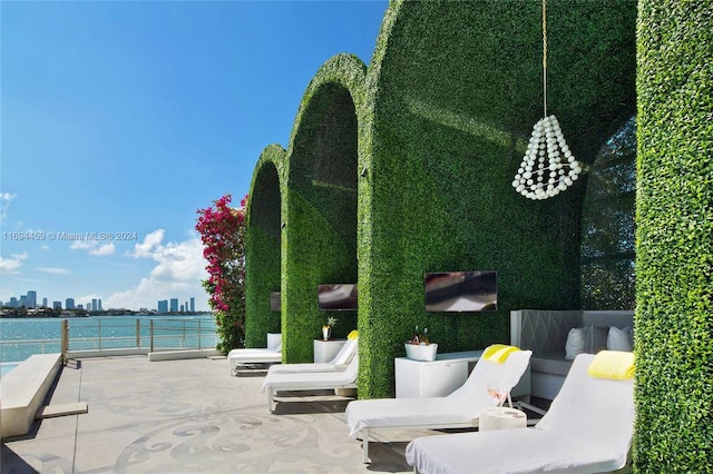 view of patio / terrace featuring outdoor lounge area and a water view