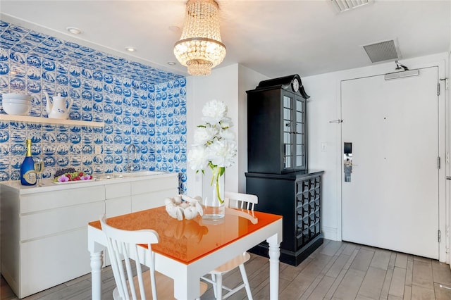 dining area with a notable chandelier