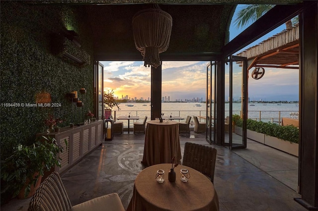 1100 W Ave Unit 918, Miami Beach, FL 33139 - view of patio with a water view and outdoor dining area