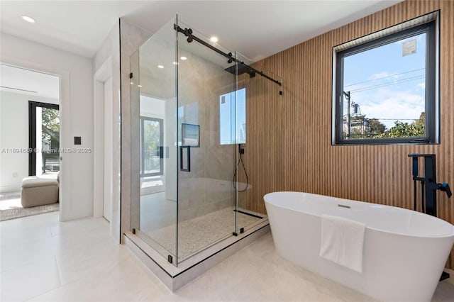 bathroom with tile patterned flooring and plus walk in shower