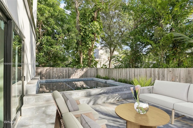 view of patio / terrace featuring a fenced in pool