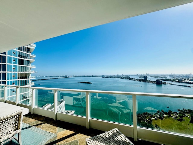 balcony featuring a water view