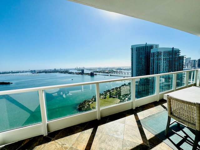 balcony featuring a water view