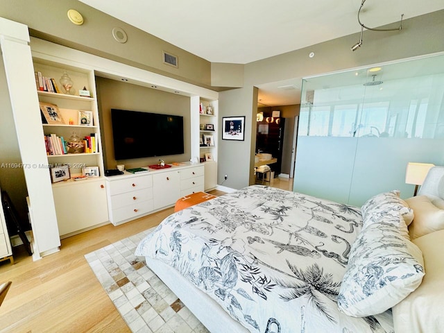 bedroom with light wood-type flooring