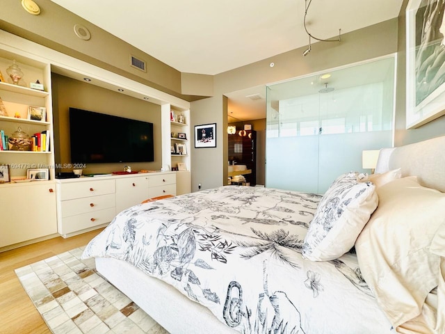 bedroom with light hardwood / wood-style flooring