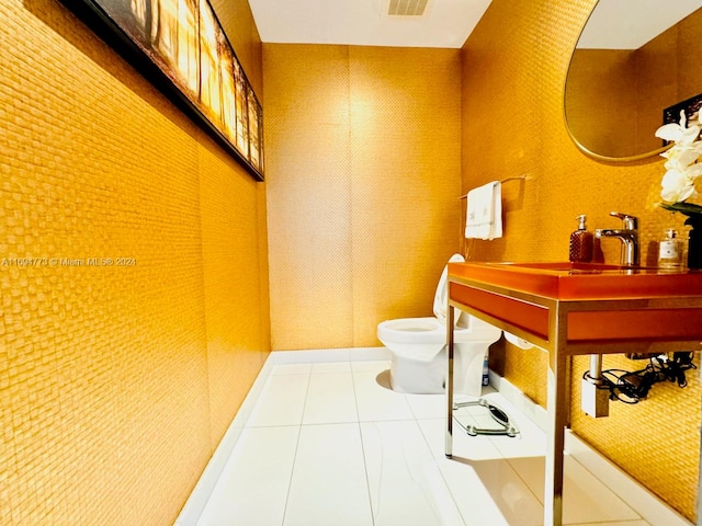 bathroom featuring tile patterned floors and toilet