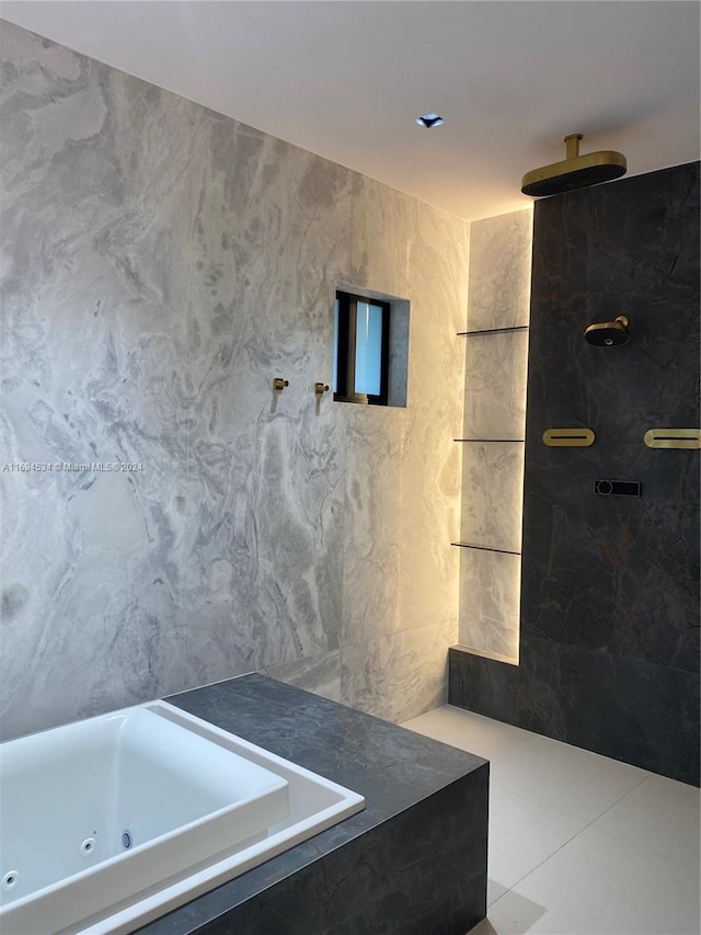 bathroom featuring tile patterned floors, tile walls, and tiled shower